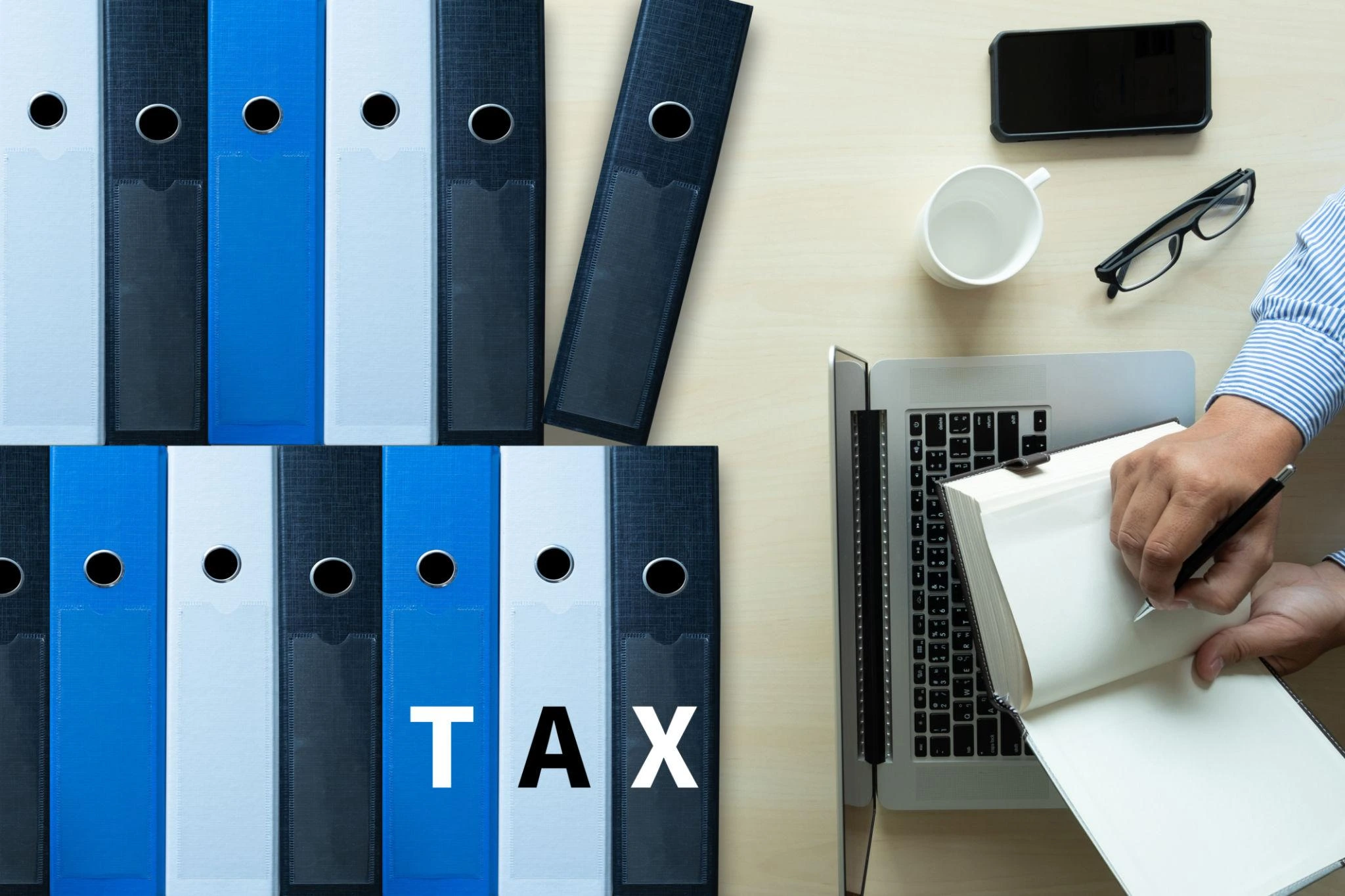 Tax compliance services with organized business records, folders, and accounting system setup.