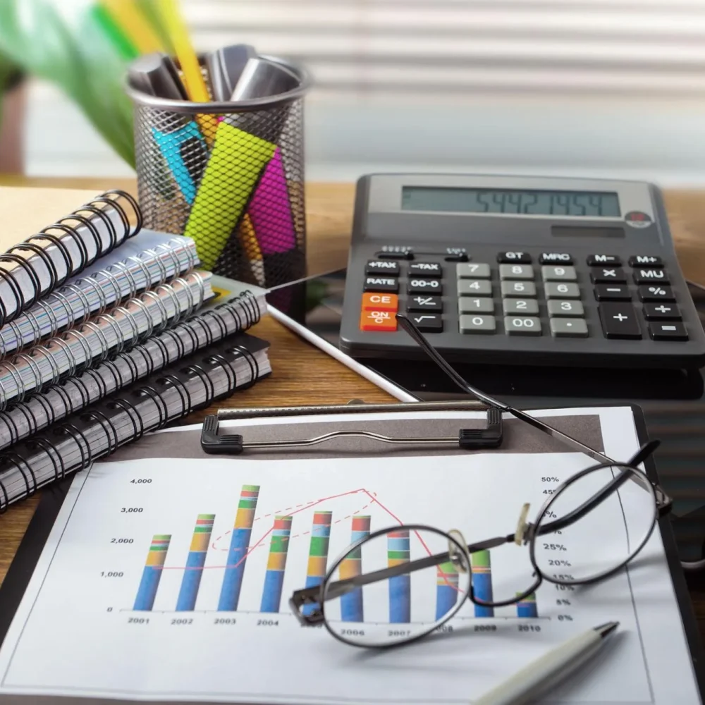 Small business bookkeeping services with financial reports, charts, and expense tracking documents.