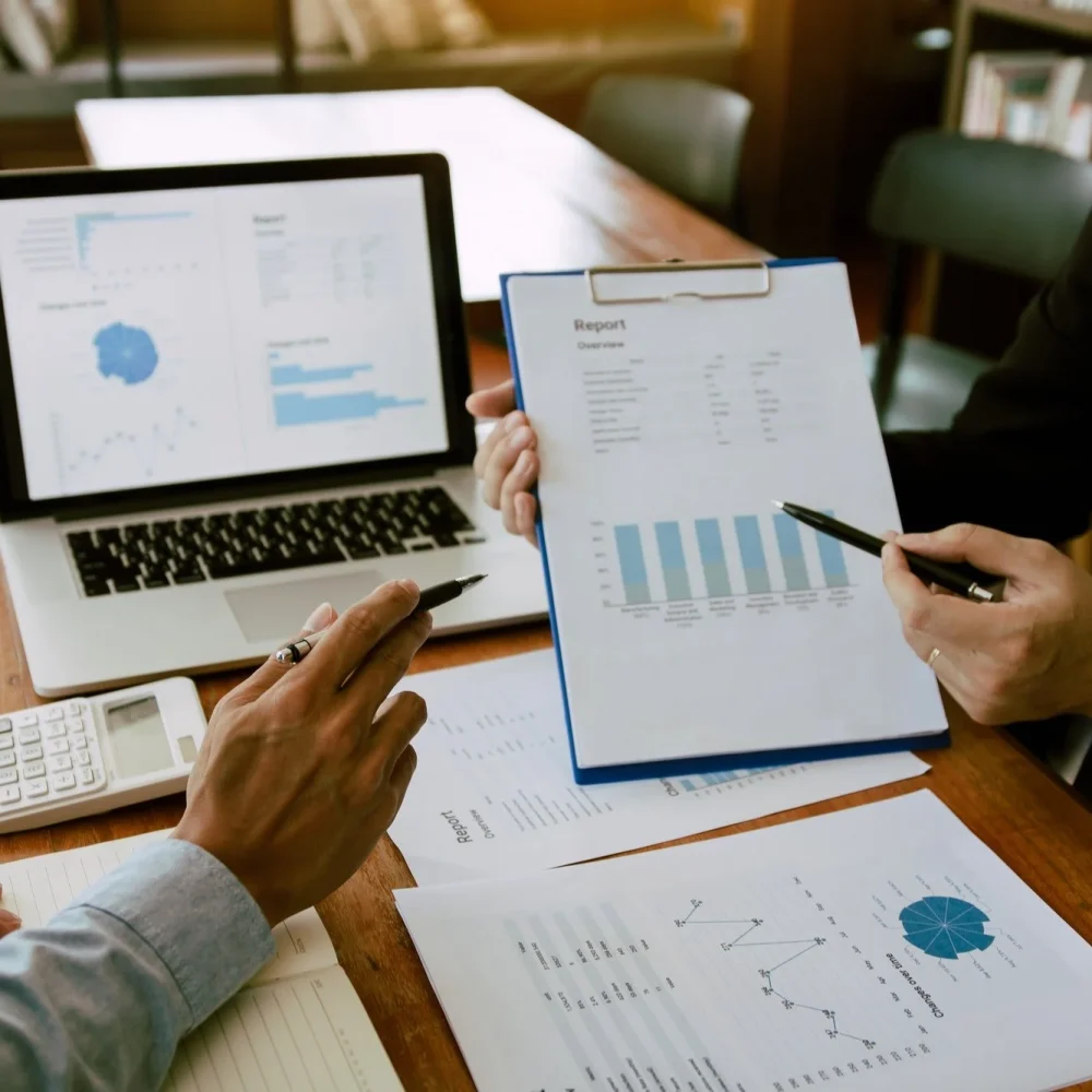 two business partnership coworkers analysis strategy with discussing a financial planning graph